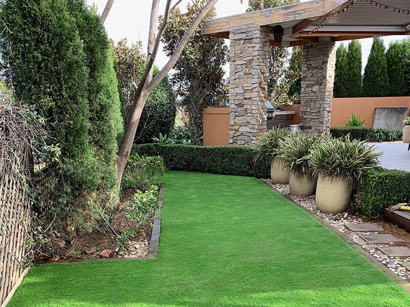 private synthetic grass on home garden